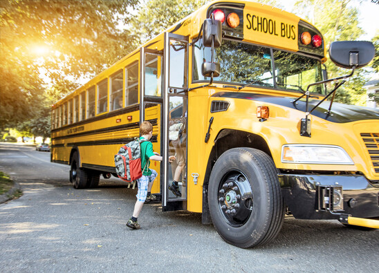 Picture of kids getting onto a school bus